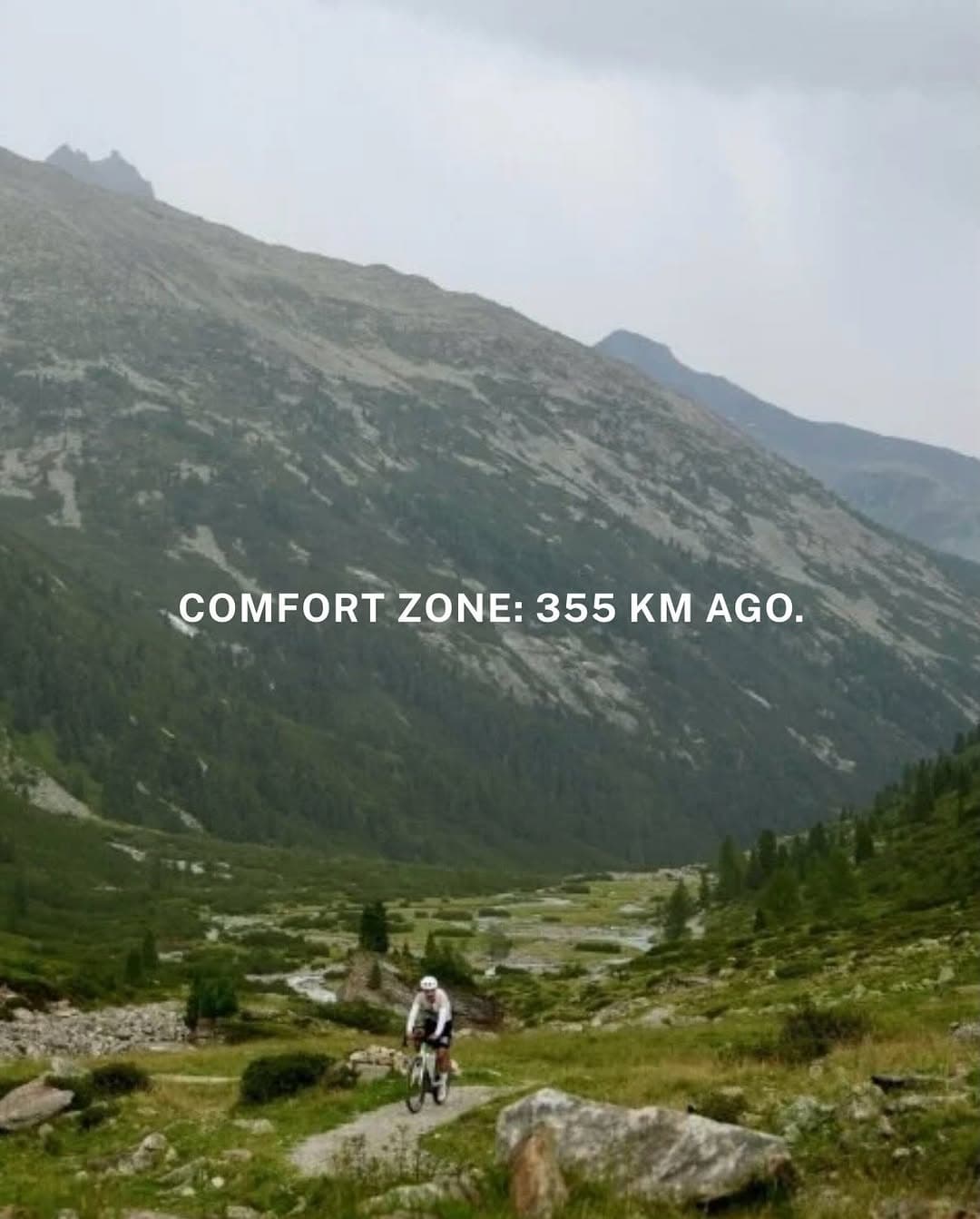 Cyclist climbing a mountain road during the Alptraum Bike Challenge in Austria