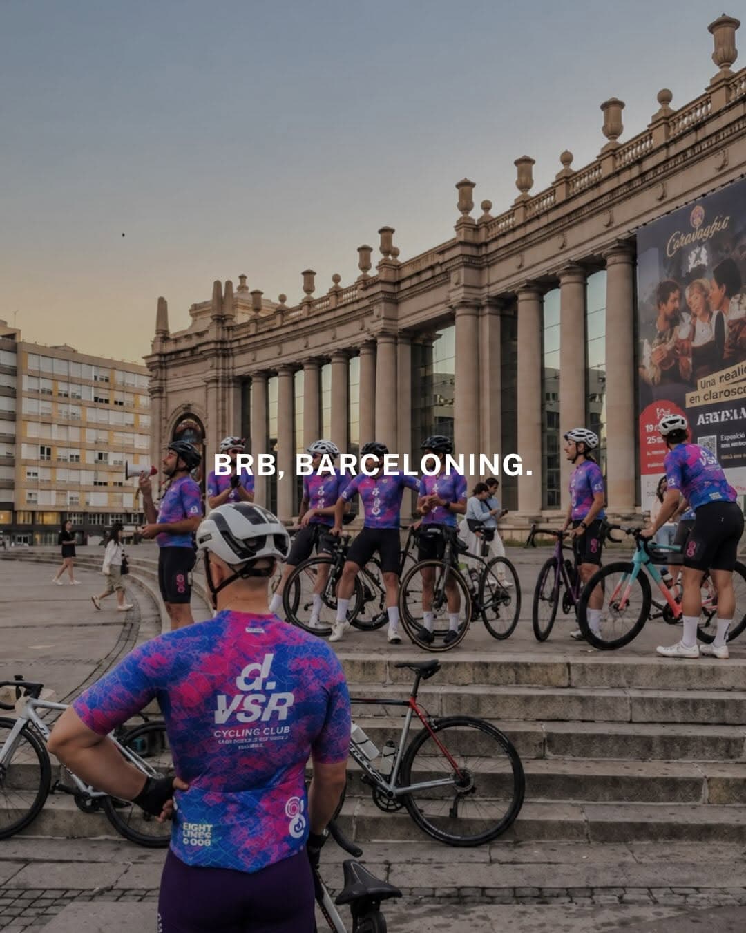 A large group of cyclists from Division Cycling Club riding together through Barcelona during the Barceloning ride