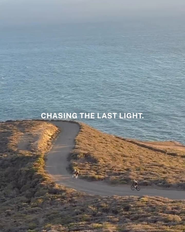 A group of cyclists riding together at sunset during a community evening ride